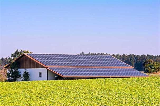 solar panels on the roof outside on the grass field